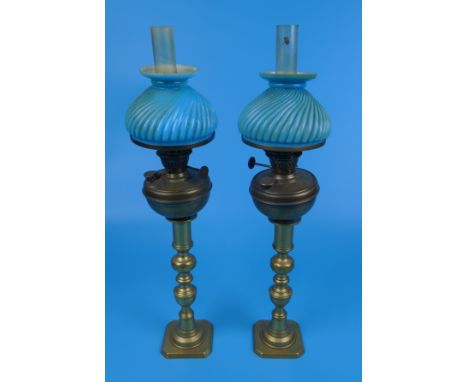 Pair of candlesticks with antique oil lamp fittings