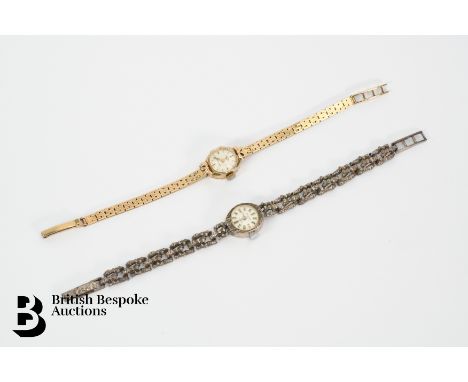 A lady's 9ct yellow gold Rotary wrist watch. The watch having a 12mm silvered face with baton markers, on a 9ct gold strap, a