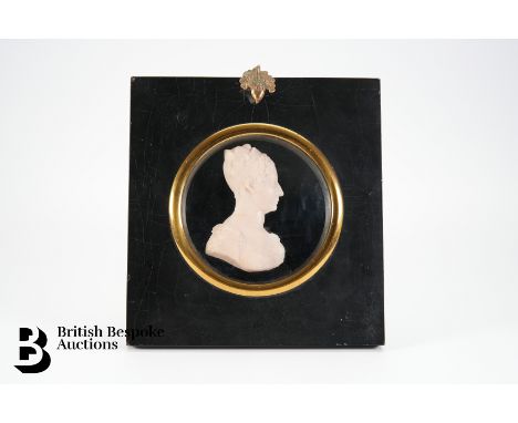 A wax profile bust portrait of Princess Charlotte Augusta of Wales, classically draped, approx 94 mm, in an ebonised frame, s