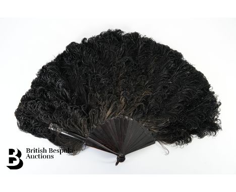 French late 19th century black ostrich feather fan. The fan having tortoiseshell sticks, the guard stick monogrammed with a c