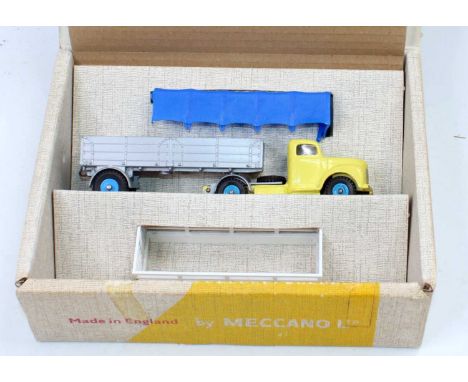 Dinky Toys No.424 Commer convertible articulated truck, comprising light yellow cab with windows, silver back, and light blue