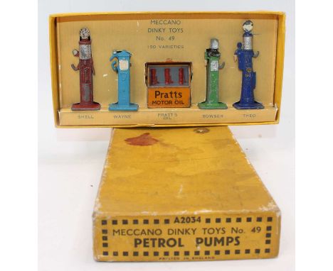 A Meccano Dinky Toys pre-war No. 49 petrol pumps gift set, housed in the original yellow ground No. A2034 card box with repro
