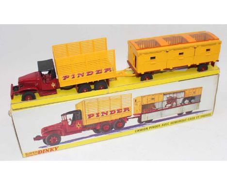 Original French Dinky No.881 GMC Circus Lorry and Trailer "Pinder", comprising of GMC Truck, maroon with maroon hubs, yellow 
