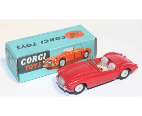 Corgi Toys 302, M.G.A sports car in red, mint condition with flat spun hubs with Corgi leaflet in a crisp original box (M-BNM