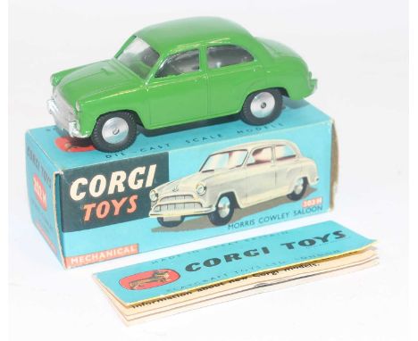 A Corgi Toys No.202m Morris Cowley saloon in green with flat spun hubs, near mint to mint condition, complete with corgi fold