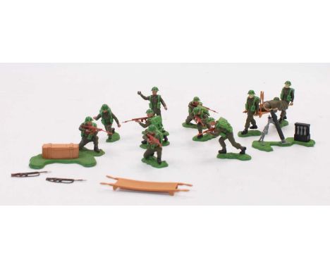 A collection of various Britains Swoppets British plastic military figures to include a kneeling whilst firing, a stretcher t
