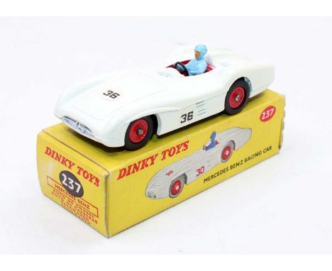 Dinky Toys No. 237 Mercedes Benz racing car comprising white matte body, red interior and red plastic hubs with blue driver a