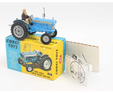 A Corgi Toys No. 67 Ford 5000 Super major tractor finished in blue with grey hubs and driver figure, complete with packing ca