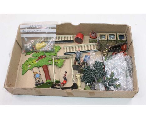 One tray containing a quantity of Britains and similar garden series lead hollow cast miniatures to include boy on swing, man