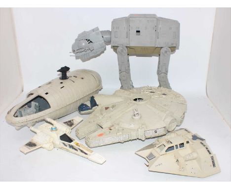 A collection of vintage Star Wars Kenner and Palitoy action figures and vehicles, to include Millennium Falcon, At-At Walker,