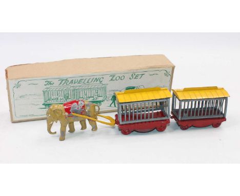 A Charbens Series travelling zoo gift set, comprising elephant-drawn cage group fitted with red bases and wheels, with base m