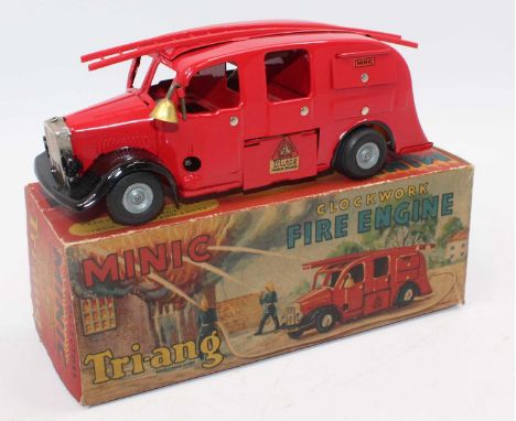Triang Minic Clockwork and Tinplate Fire Engine, comprising red body with plastic ladder, in the original box, (VGNM-BVG)