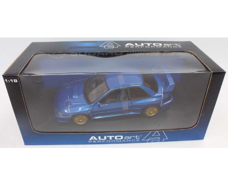 An Auto Art model No. 78601 1/18 scale diecast model of a metallic blue Subaru Impreza 22B housed in the original window box