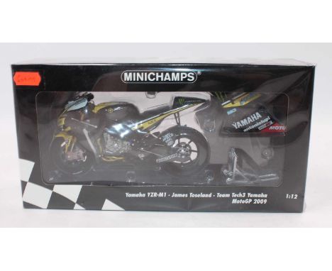 A Minichamps No. 122093052 1/12 scale model of a 2009 Moto GP James Toseland Yamaha YZR-M1 appears as issued in the original 