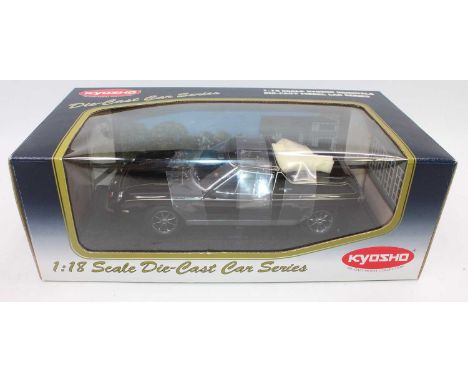 A Kyosho 1/18 scale diecast model of a Lotus Europa Special finished in black and gold model No. 08151K housed in the origina