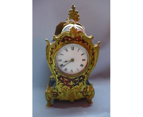 A French mantle clock, having white dial with Roman numerals 