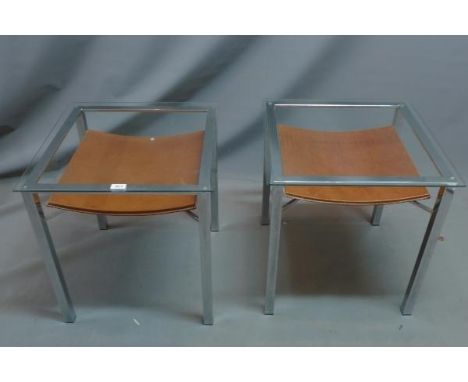 A pair of Rolf Benz style chrome lamp tables, with glass top and leather under tier, H. 56 W. 53 D. 53cm 
