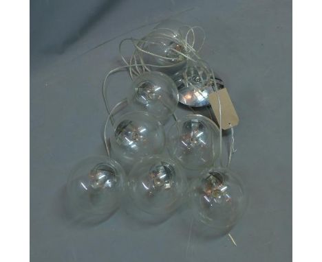 A Contemporary German ceiling light, having seven hanging spherical glass lights (one missing) 