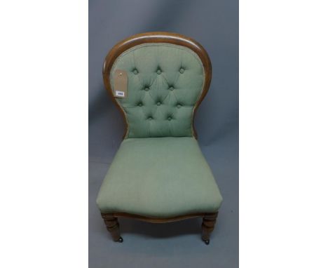 A Victorian mahogany bedroom chair, with green button back linen upholstery 