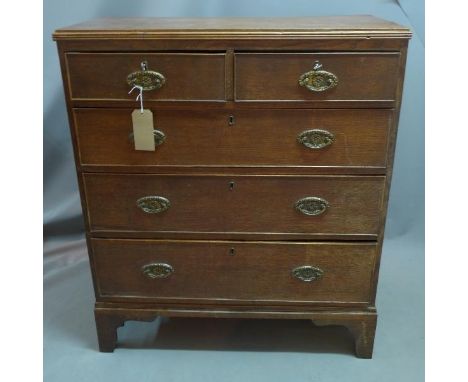 A Regency oak chest of two short over three long drawers, raised on bracket feet, H. 113 W. 98 D. 47cm 