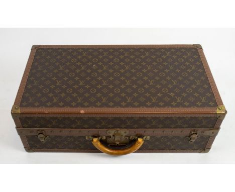 LOUIS VUITTON SUITCASE, monogram pattern with tan leather, 68cm x 45cm x  22cm (travel worn condition).