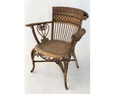 ARMCHAIR, early 20th century 1930s rattan frame and green and natural intricately cane woven with stick back and outswept arm