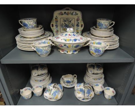 A large dinner or tea service by Masons in the Regency pattern 100 pieces approxSome cups are stained as are a couple of plat
