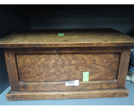 A vintage oak candle stick box