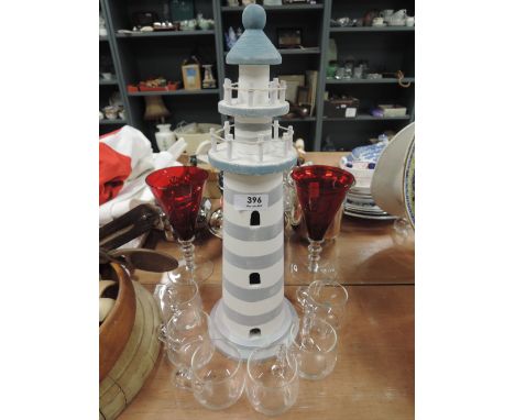 A modern model of a light house and glasses set