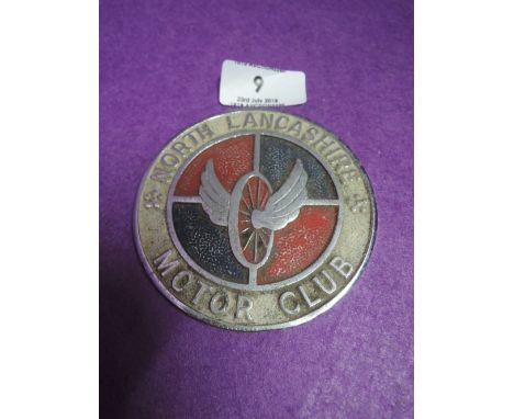 A vintage car engine badge for North Lancashire Motor Club 