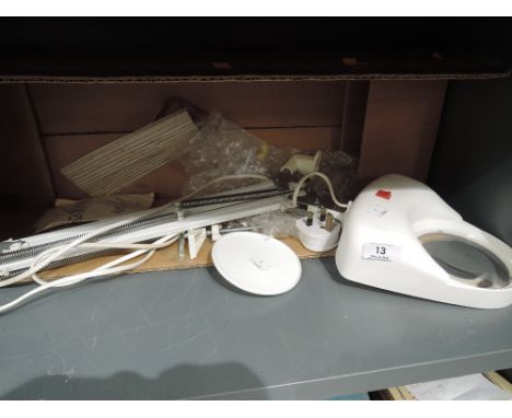 A modern reading lamp with magnifier in box as new