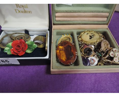 A small selection of costume jewellery including Royal Doulton porcelain brooch, scarf ring etc