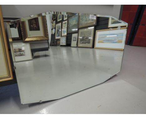 A vintage hallway or mantle mirror with art deco design