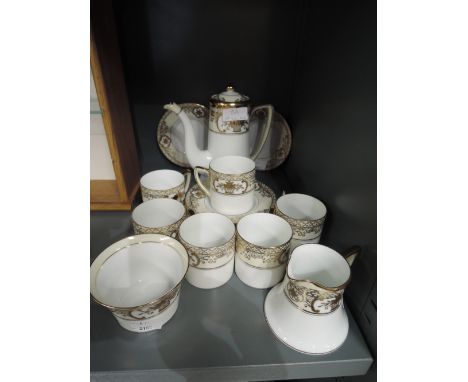 A Noritake coffee service in cream and gilt on a white ground6 coffe cups, 6 saucers, 1 teapot, 1 cream and 1 sugar
