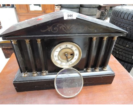 A marble mantel clock with enamel face