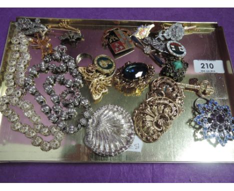 A selection of costume jewellery including Land Army badge, Ladies Golf Union badge, white metal necklaces, rings, brooches e