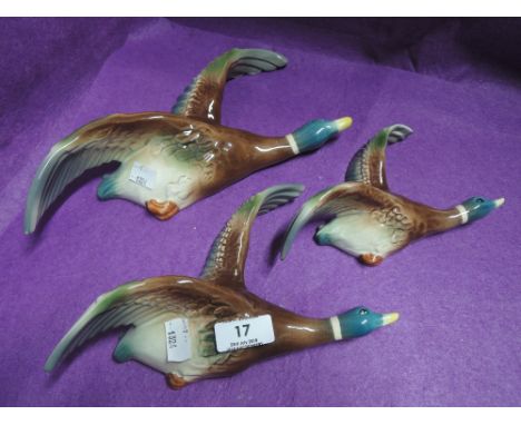 A set of graduated ceramic ducks wall mounted plaque style