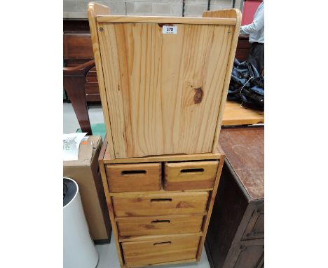 A set of modern pine drawers and hamper style box