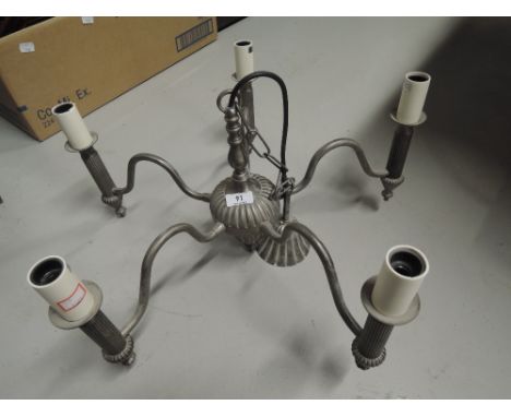 A vintage chandelier light fitting