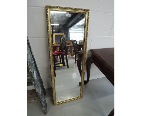 A modern gilt frame wall mirror