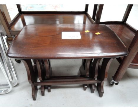 A nest of three tables in the Ercol style