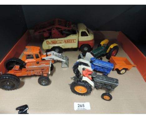 Three Britains diecast tractors, a Lone star diecast tractor, a similar diecast  Massey Ferguson loader tractor and a Triang 