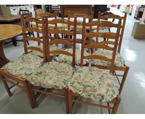 A set of six ladder back pine chairs
