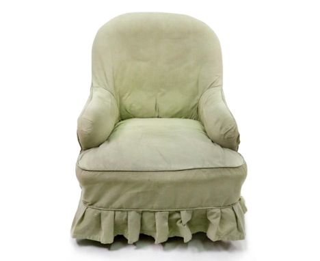 A Victorian mahogany frame armchair, button down upholstered, on turned legs and castors.