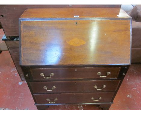 An Edwardian mahogany and inlaid bureau with three graduated drawers on bracket feet 