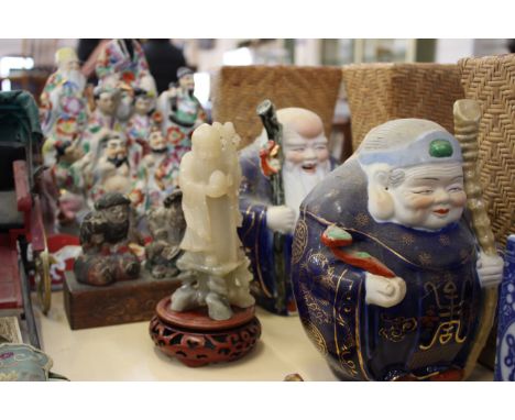 Chinese Artefacts, a group of Deities, two wise men, a root carving of a monkey, three wicker pillows, model rickshaw, a Hong