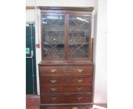 A George III mahogany secretaire bookcase, dentil cornice, astragal glazed, fitted drawer, two short and two long drawers, on