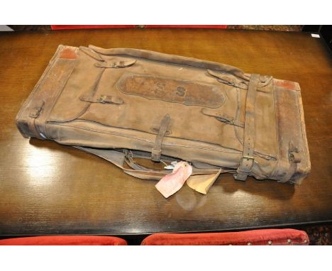 Boss &amp; Co fitted leather gun travel case constructed of oak bound in leather with brass corner caps and brass push lock .