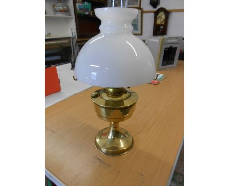 Brass oil lamp with white glass shade 