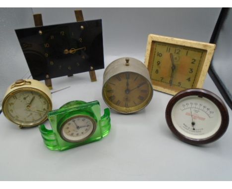 Collection of retro clocks and a thermometer